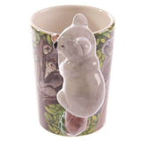 Ceramic mug with whimsical koala-shaped handle, perfect for coffee or tea lovers, holding 400ml of your favorite beverage.