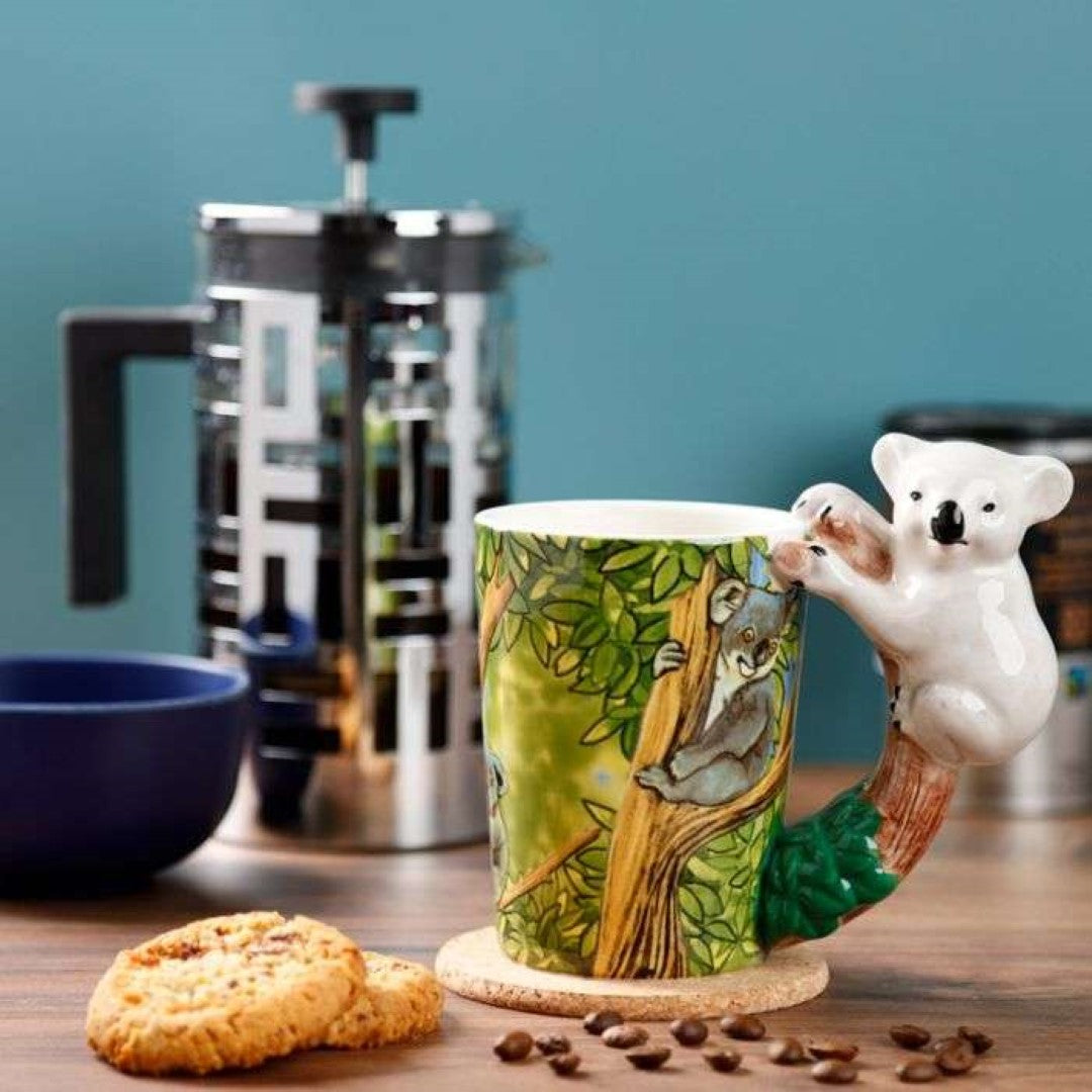 Ceramic mug with a koala-shaped handle, holding 400ml, combining whimsical design and functionality for coffee or tea lovers.