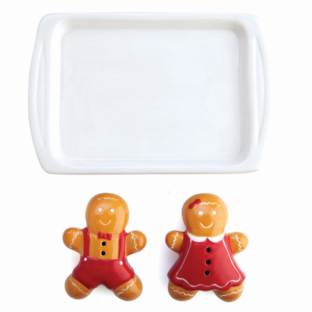 Ceramic gingerbread-shaped salt and pepper shakers with cute baking tray holder, perfect for festive dining.