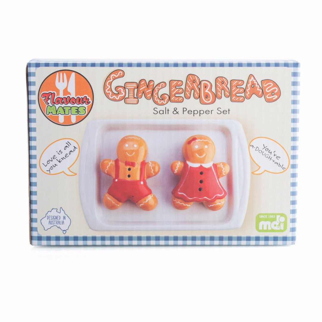 Ceramic gingerbread-shaped salt and pepper shakers with a cute baking tray holder, perfect for festive dining.