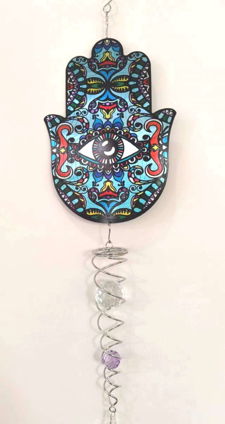 Intricate Hamsa symbol wind spinner, 45cm, adds elegance and spiritual protection to gardens and patios.