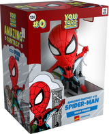 Youtooz 5" collectible Spider-Man figurine in red and blue suit, swinging through grey buildings, holding a flailing civilian.