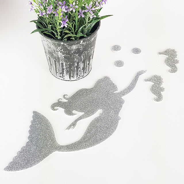 Whimsical glitter-finished wall art set featuring a mermaid and seahorse, perfect for children's room decor.