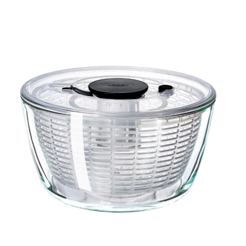 OXO Good Grips Glass Salad Spinner with a non-slip knob, designed for effortless salad prep and serving in a chic glass bowl.