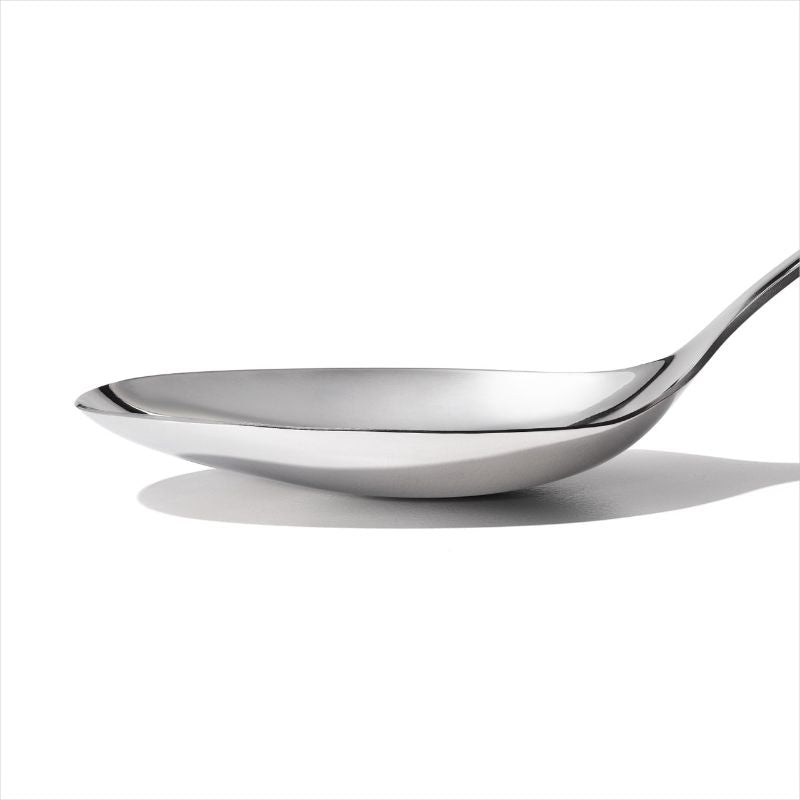 Sleek stainless steel cooking spoon with ergonomic handle, perfect for stirring, serving, and easy cleanup.