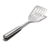 OXO STEEL Cooking Turner with a sturdy stainless steel head and comfortable non-slip handle for versatile kitchen use.