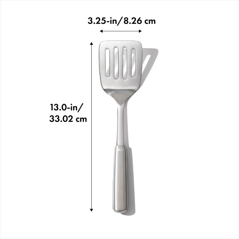 High-quality OXO STEEL Cooking Turner with a sturdy head and non-slip handle for easy flipping and serving of foods.