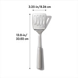 High-quality OXO STEEL Cooking Turner with a sturdy head and non-slip handle for easy flipping and serving of foods.