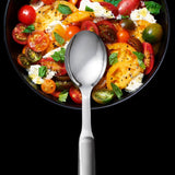 OXO Steel Serving Spoon with deep well design, non-slip handle, and durable stainless steel for effortless serving.