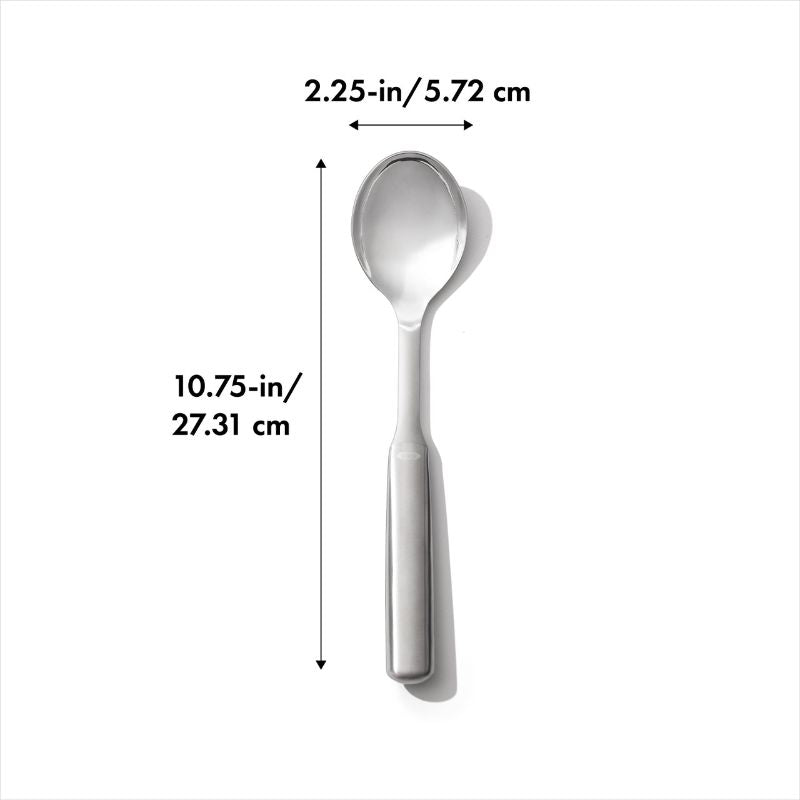 Durable stainless steel serving spoon with deep well design and non-slip handle for effortless scooping and serving.