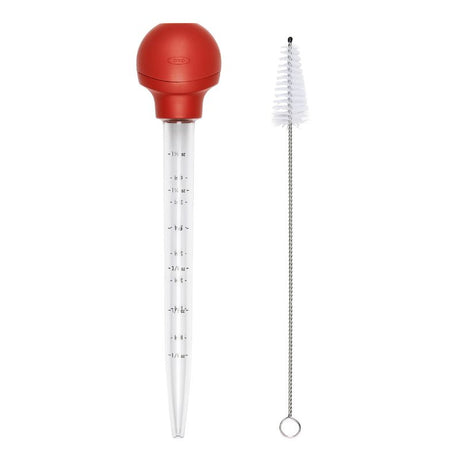 OXO Baster with Cleaning Brush features a unique design for comfort, flat bulb for stability, and dishwasher-safe for easy cleaning.