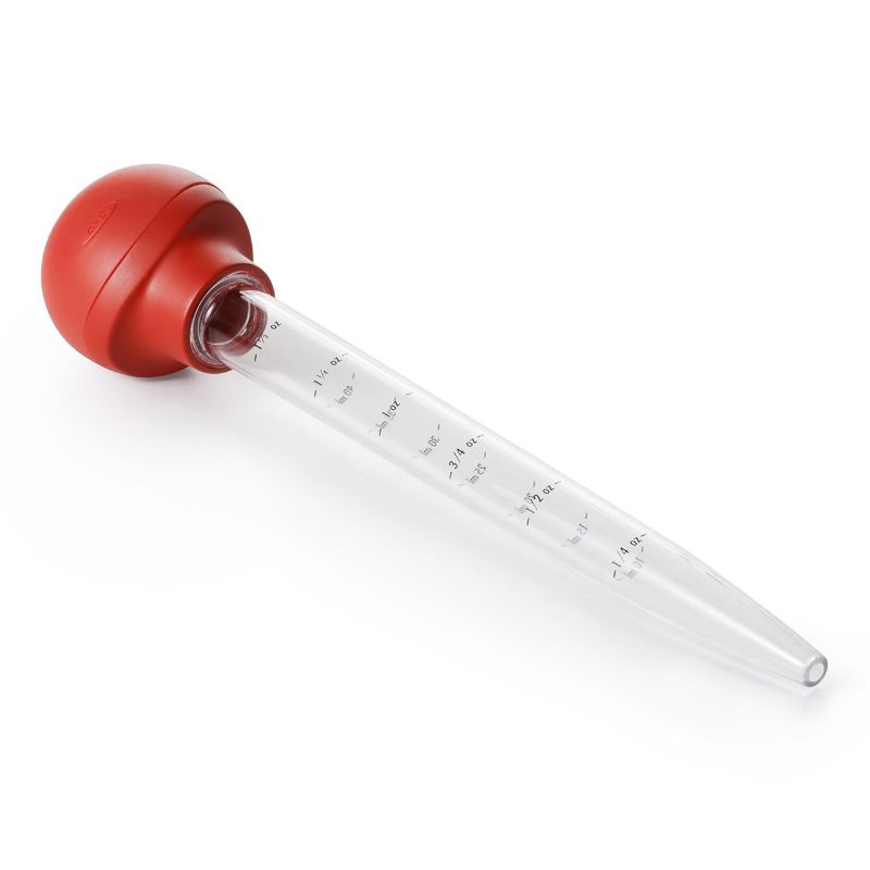 OXO Baster with Cleaning Brush featuring a flat bulb for stability, high-heat resistant tube, and easy measurement markings.