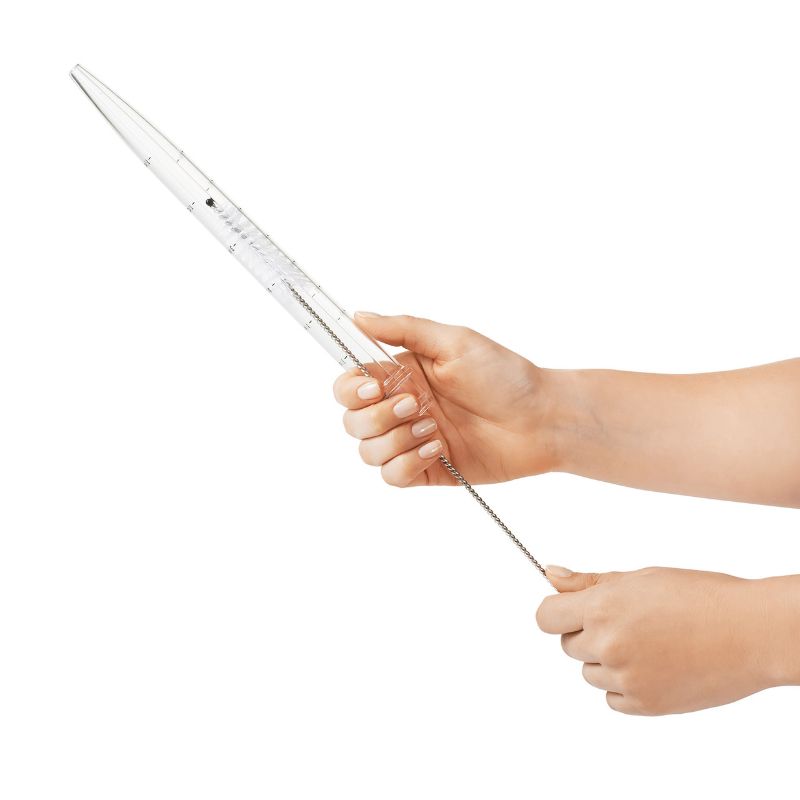 OXO Baster with Cleaning Brush featuring a flat bulb for stability, durable high-heat plastic, and clear measurement markings.