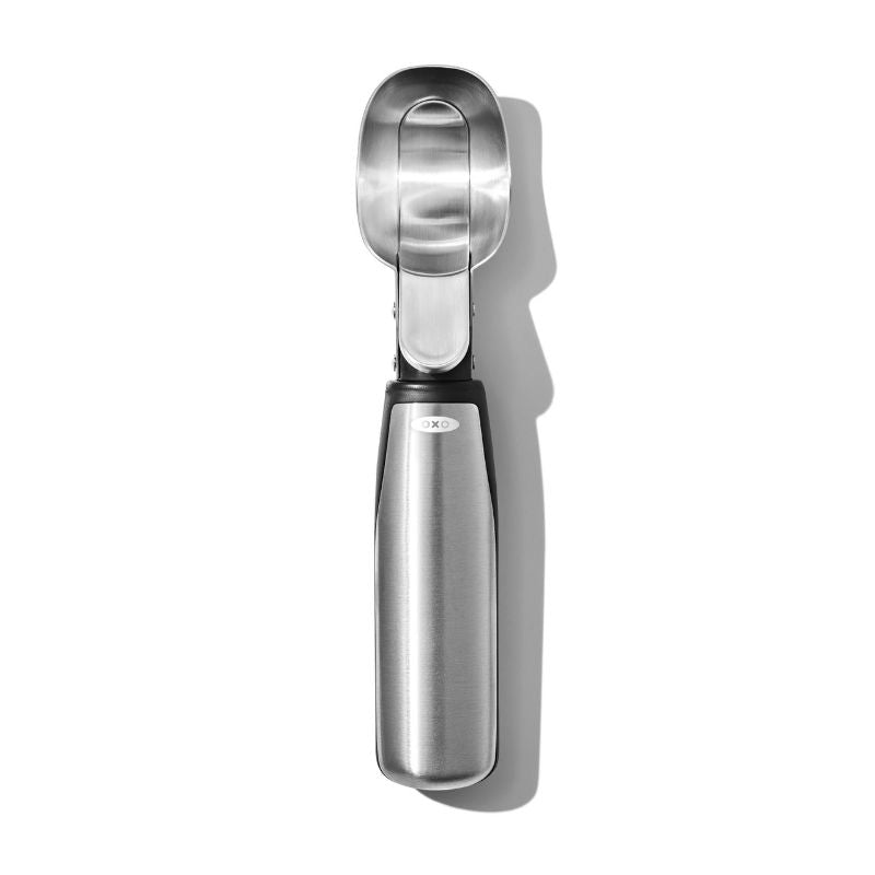 Brushed stainless steel ice cream scoop with lever for easy serving, featuring soft grips and dishwasher-safe design.