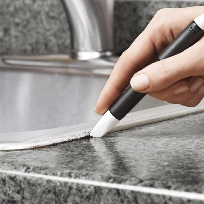 OXO Good Grips Kitchen Appliance Cleaning Set with brushes and scrapers for deep cleaning tight spaces in appliances.