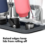 OXO Good Grips Water Bottle Drying Rack holds 4 bottles and straws, promoting hygiene with elevated drying and compact storage.