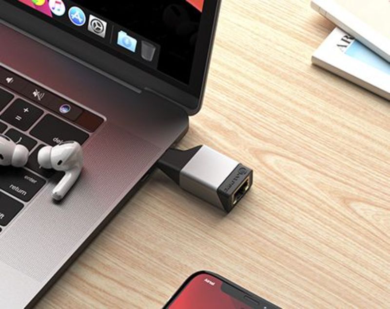 Alogic Ultra Mini USB-C to RJ45 adapter in space grey, compact design for high-speed internet on the go, ideal for travelers.