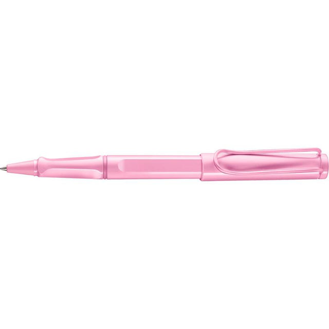 Light rose Lamy Safari Rollerball pen, featuring a sturdy plastic barrel and iconic spring-loaded metal clip for stylish writing.