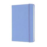 Pocket-sized Moleskine notebook in hydrangea blue, featuring acid-free ivory pages, elastic closure, and expandable inner pocket.