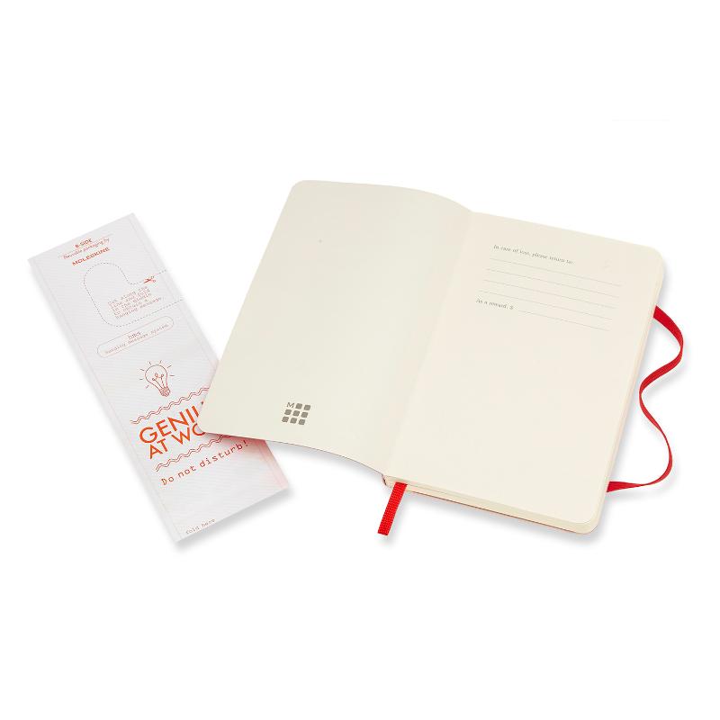 Scarlet red Moleskine notebook with soft cover, plain pages, elastic closure, and bookmark, perfect for portable creativity.