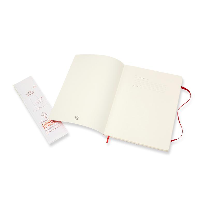 Scarlet red Moleskine XL notebook with soft cover, elastic closure, and ivory pages for writing and sketching.