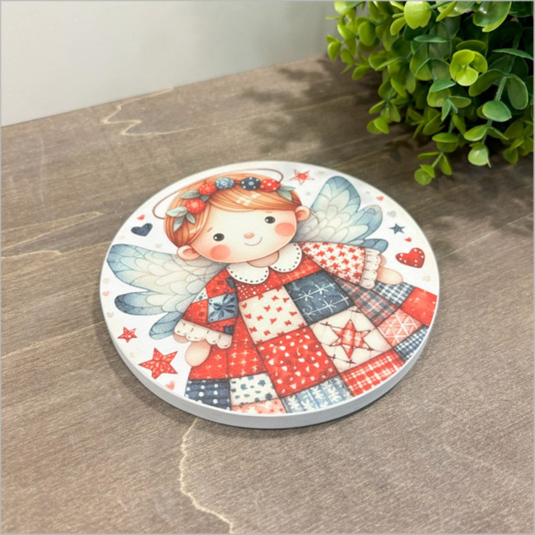 Canvas circle wall art featuring vibrant red patchwork angel design, 150mm diameter, ready to hang or display on easel.