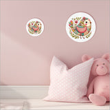 Large pink canvas circle featuring a whimsical patchwork bird design, perfect for brightening up any room.