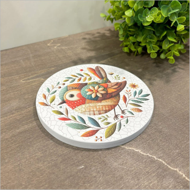 Canvas circle featuring a brown patchwork bird design, perfect for home decor or gift giving, 150mm in diameter.