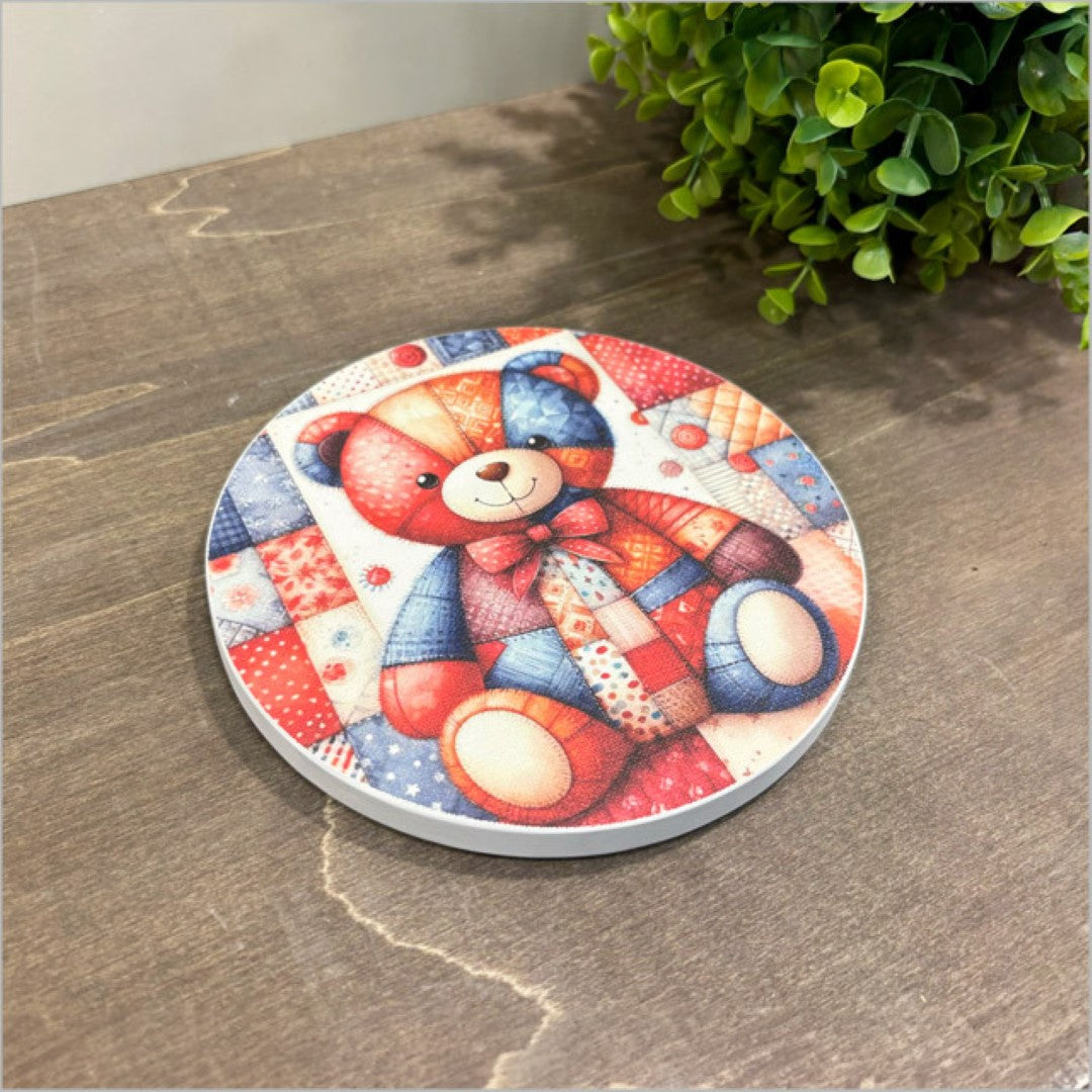 Canvas circle art featuring a charming patchwork bear design, perfect for kids' rooms or cozy decor.