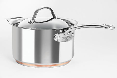 Chasseur Le Cuivre 3.4L saucepan with domed lid, copper core, and elegant stainless steel design for superior heat distribution.