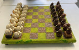 Sheep vs Kiwi Chess Set featuring unique sheep and kiwi pieces on a lush green board, perfect for strategy and cultural charm.