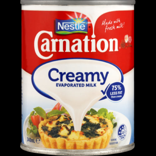 Nestle Carnation Creamy Evaporated Milk can, 340ml; a low-fat, shelf-stable milk for creamy recipes and desserts.