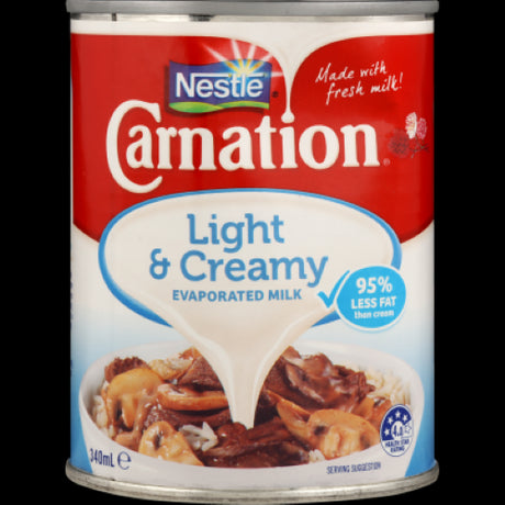 Nestle Carnation Light & Creamy Evaporated Milk Can (340ml) for rich, low-fat creamy cooking in sweet and savory dishes.