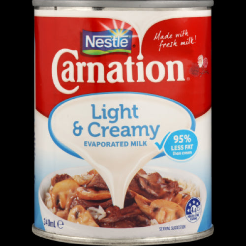 Nestle Carnation Light & Creamy Evaporated Milk Can (340ml) for rich, low-fat creamy cooking in sweet and savory dishes.