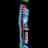 Reach Between Medium Toothbrush with multi-level bristles for effective plaque removal and gentle gum protection.