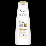 Dove Restoring Ritual Shampoo 320ml enriched with coconut oil and turmeric, designed to strengthen and nourish damaged hair.