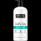 TRESemm&eacute; Smooth & Silky Conditioner in 940ml, enriched with Sunflower Seed Oil, control frizz and provide intense moisture.