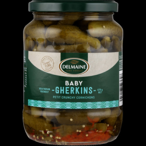 Delmaine Baby Gherkins 670g jar, featuring crisp, tangy cornichons perfect for gourmet platters and snacks.