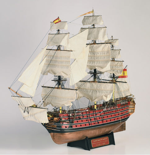 Intricate wooden model of the 1/84 scale Santisima Trinidad, capturing historical maritime craftsmanship and elegance.