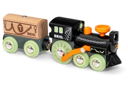 BRIO Ghost Train three-piece set features a glowing steam engine, wagon, and mysterious wooden casket for imaginative play.