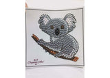 Colorful CrystalArt Koala Bear motif kit for DIY crafting, includes sparkling crystals and tools for a 9x9cm dazzling project.