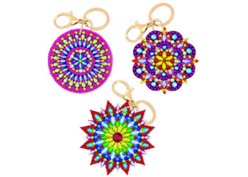 Colorful mandala keyring kit with templates, crystal gems, and tools for creative DIY crafting projects.