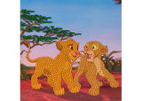 Colorful CrystalArt kit featuring Simba and Nala for creating a sparkling 18x18cm greeting card. Perfect for ages 8 and up.