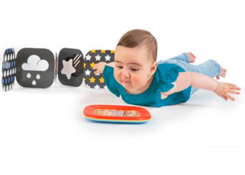 Colorful Halilit Tummy Time Shaking Drum for sensory play, featuring gentle sounds and vibrant beads for auditory and visual stimulation.