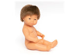 A 38cm Caucasian boy doll with Down Syndrome, promoting inclusivity and imaginative play while featuring articulated limbs and a scented body.