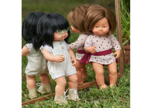 Caucasian girl doll with Down Syndrome, 38cm, soft vinyl, articulated, promotes inclusivity and empathy in children.