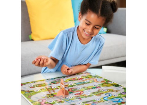 Colorful board game featuring a large playing area, chunky pieces, and educational elements for kids aged 3-6.