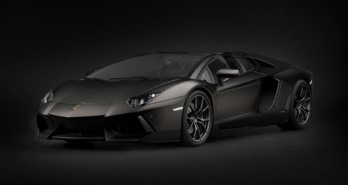 Highly detailed black diecast model kit of the Lamborghini Aventador Roadster, perfect for collectors and hobbyists.