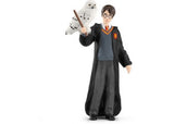 Harry Potter in Gryffindor uniform with wand and glasses, alongside his loyal snowy owl, Hedwig, for magical adventures.