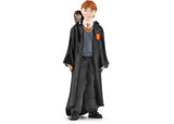 A detailed figurine set featuring Ron Weasley and his pet rat Scabbers from the Wizarding World, perfect for play and collecting.